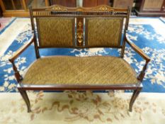 AN EDWARDIAN INLAID SALON SETTEE, the shaped top rail and central splat with ivory and satin wood