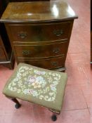 A REPRODUCTION MAHOGANY BOW FRONT CHEST OF THREE DRAWERS on corner bracket feet and an ebonized