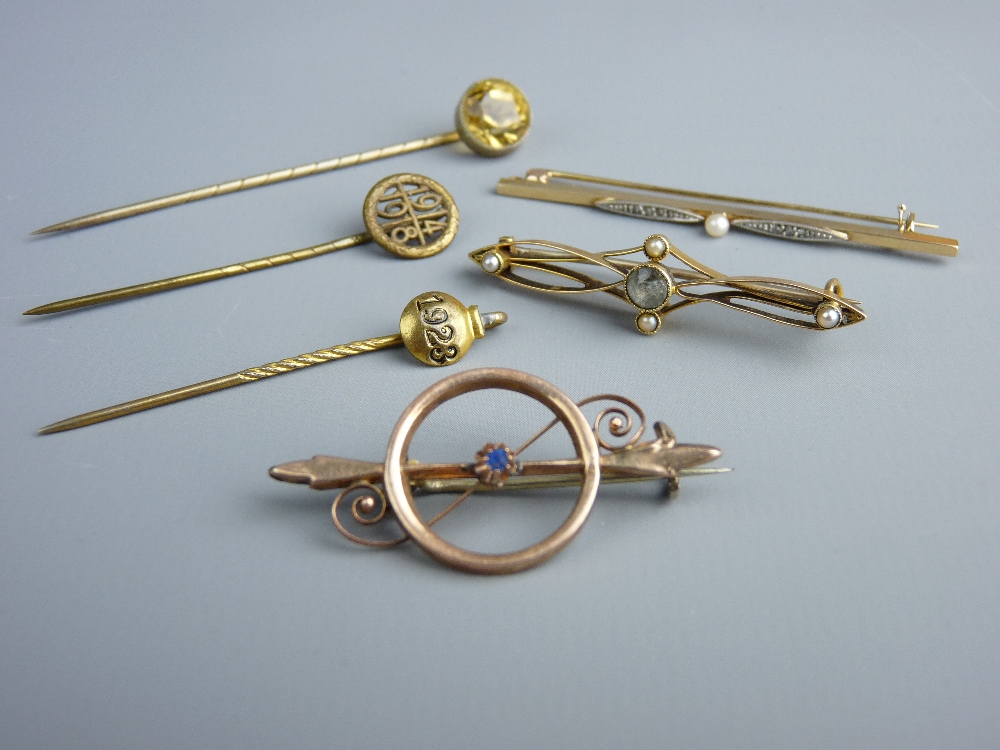 TWO GOLD BAR BROOCHES and another dart and circle brooch, believed gold, total 5.2 grms, a yellow