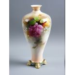 A ROYAL WORCESTER HAND PAINTED BALUSTER VASE by R Austin, having a gilt rim and neck band over a