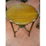 AN EDWARDIAN MAHOGANY TWO TIER CIRCULAR TABLE with boxwood stringing, 73 cms high, 56 cms diameter