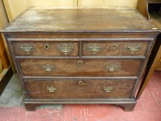 A 19th CENTURY EUROPEAN OAK CHEST of two short over two long drawers, oak lined with period and