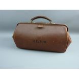 A VINTAGE GLADSTONE BAG stamped with the letters 'S L E V W', 50 cms across