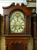 A VICTORIAN MAHOGANY ARCHED DIAL LONGCASE CLOCK by S J Bibby, Carnarvon, the well painted dial set