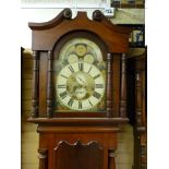 A VICTORIAN MAHOGANY ARCHED DIAL LONGCASE CLOCK by S J Bibby, Carnarvon, the well painted dial set