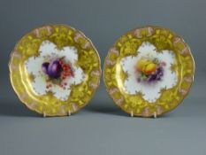 TWO ROYAL WORCESTER CABINET PLATES, hand painted fruit signed 'G H Cole' and 'H Martin', the 22.5