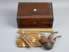 A SMALL ROSEWOOD BOX used as a cigar box containing a parcel of cigars