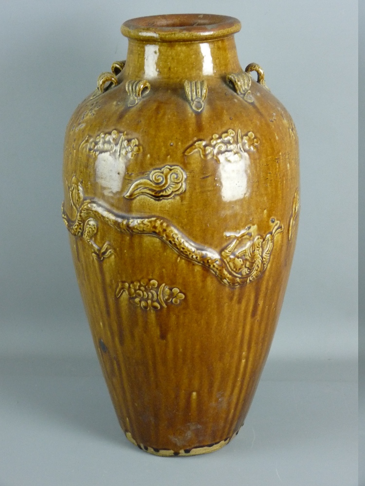 A LARGE MARTABAN BALUSTER SHAPED NARROW NECKED JAR, 60 cms high having raised dragons and eight