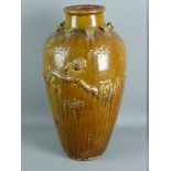 A LARGE MARTABAN BALUSTER SHAPED NARROW NECKED JAR, 60 cms high having raised dragons and eight