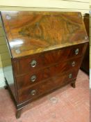 A GOOD GEORGIAN STYLE MAHOGANY FALL FRONT BUREAU with ebony inlay to the fall, the interior with