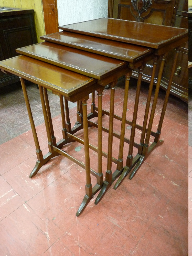 A GOOD QUARTETTO OF EDWARDIAN MAHOGANY SIDE TABLES with beaded edge top decoration on turned slender