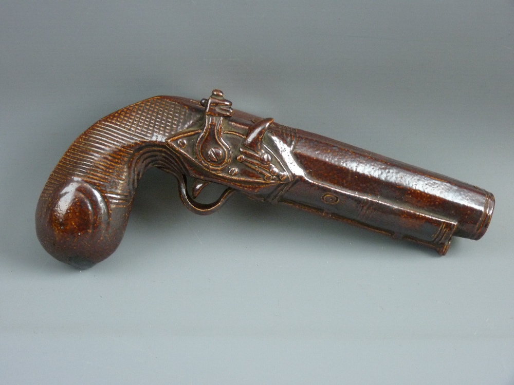 A SALT GLAZED POTTERY FLASK in the form of a flintlock pistol, stamped 'Stephen Green, Imperial