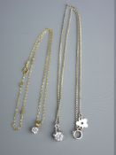 TWO CZ PENDANTS, one on a silver link chain, total 1.2 grms and a cz pendant on a silver link chain,