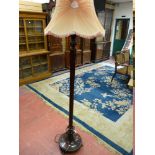 A GOOD CARVED WALNUT STANDARD LAMP WITH SHADE