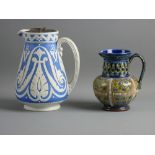 A COPELAND BLUE GROUND SEMI-GLAZED NARROW NECK JUG with raised Gothic style pattern, scrolled handle