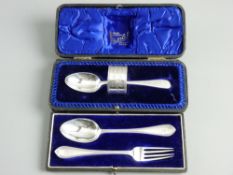 A CASED HALLMARKED SILVER NAPKIN RING & SPOON SET and a cased fork and spoon set, Sheffield 1897 and