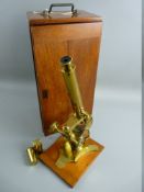 A BAKER OF LONDON MAHOGANY CASED BRASS MONOCULAR MICROSCOPE having additional lenses and glass