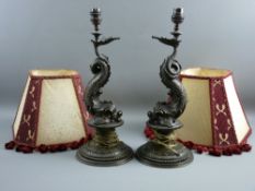 A PAIR OF EMPIRE STYLE MYTHICAL DOLPHIN TABLE LAMPS with shades, the cast metal with bronze effect