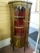 A REPRODUCTION VERNIS MARTIN STYLE DISPLAY CABINET having a central bow glass door and side panels