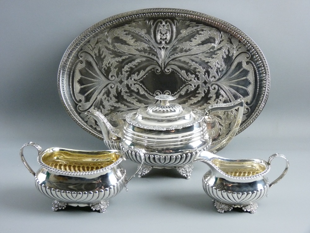 A CLOSELY MATCHED GEORGIAN SILVER TEA SERVICE with gadrooned bodies, the teapot hallmarked London