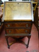 A NEAT WALNUT LADY'S WRITING BUREAU, the crossbanded fall opening to reveal an arrangement of