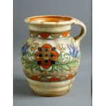 A CHARLOTTE RHEAD FOR CROWN DUCAL JUGS, tube lined decorated in colourful tones on a ribbed sand