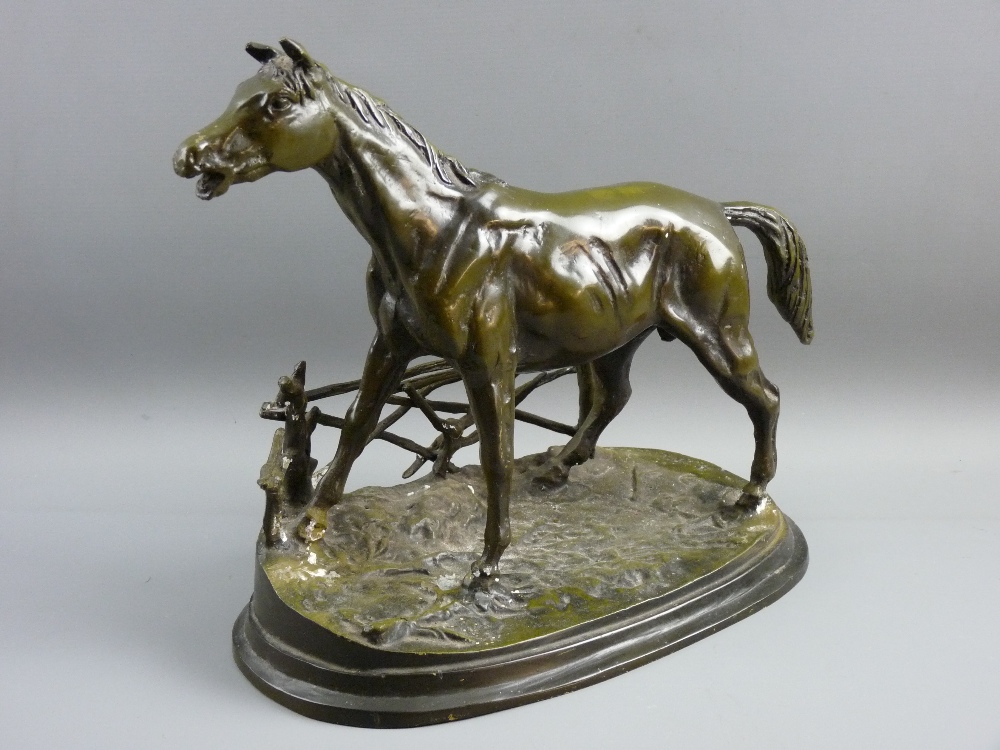 AFTER PIERRE JULES MENE PATINATED BRONZE OF A HORSE against a rail fence, on an oval base,