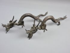 A PAIR OF QUING DYNASTY CHINESE BRONZE CREEPING DRAGONS, 28 cms long (damage to hind leg of one,