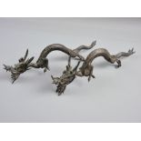 A PAIR OF QUING DYNASTY CHINESE BRONZE CREEPING DRAGONS, 28 cms long (damage to hind leg of one,