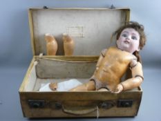 A LARGE SIMON & HALBIG BISQUE HEADED DOLL with rolling blue eyes, open mouth showing four teeth,