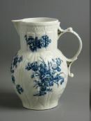 A WORCESTER CABBAGE LEAF MOULDED MASK JUG, circa 1770, decorated in the 'Three Flowers' pattern with