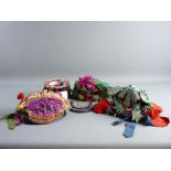 FOUR VINTAGE CHINESE BONNETS & A POUCH, all in rich embroidered colours including two in the form of