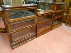 A THREE PART EIGHT SECTION GLOBE WERNICKE MAHOGANY BOOKCASE with lift up glass fronted sliding doors