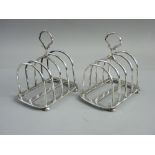 A MATCHING PAIR OF HALLMARKED SILVER TOAST RACKS by Hukin & Heath, Birmingham dates for 1921 and