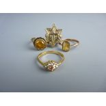 A PARCEL OF THREE NINE CARAT GOLD DRESS RINGS and a fourteen carat gold star and crucifix ring,