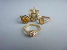 A PARCEL OF THREE NINE CARAT GOLD DRESS RINGS and a fourteen carat gold star and crucifix ring,