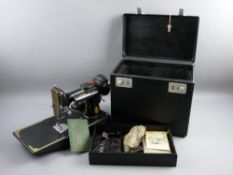 A SINGER FEATHERWEIGHT 221 CASED SEWING MACHINE in original case with foot pedal and lift-out top