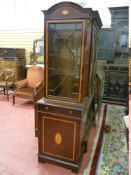 A REPRODUCTION MAHOGANY DISPLAY CABINET, the arched top with Sheraton fan inlay, a single glazed
