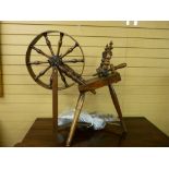 AN ANTIQUE OAK & ELM SPINNING WHEEL, 82.5 cms high, 80 cms approximate width