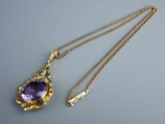 A FINE LINK GOLD CHAIN with a scrolled and leaf mounted circular purple quartz pendant, 16.5 grms