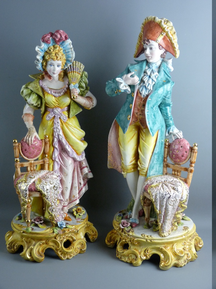 AN IMPRESSIVE PAIR OF CAPODIMONTE FIGURES of a young man and woman classically dressed and in