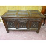 AN 18th CENTURY OAK COFFER, the six section panelled lid over matching panel sides, the front