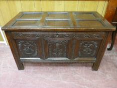 AN 18th CENTURY OAK COFFER, the six section panelled lid over matching panel sides, the front