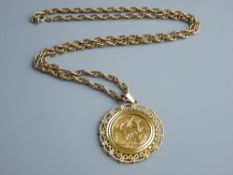 A FULL GOLD SOVEREIGN 1911 in a scrolled and gold filigree mount, 11 grms approximately, together