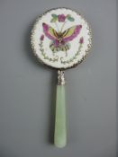 A SMALL ENAMELLED PORCELAIN BACKED CHINESE HAND MIRROR having a celadon jade handle, the porcelain