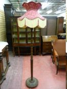 A VINTAGE MAHOGANY STANDARD LAMP and classically styled tasselled edge shade