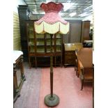 A VINTAGE MAHOGANY STANDARD LAMP and classically styled tasselled edge shade