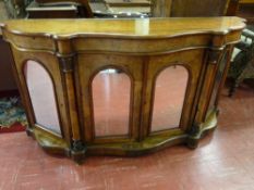 A VICTORIAN INLAID WALNUT CREDENZA, the serpentine top over four mirrored cupboard doors, the