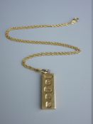 A NINE CARAT GOLD OBLONG INGOT with fine link chain, total 17.5 grms