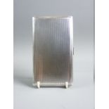 A FULL SIZE OBLONG ENGINE TURNED GENT'S SILVER CIGARETTE CASE, 7.9 troy ozs, Birmingham 1951